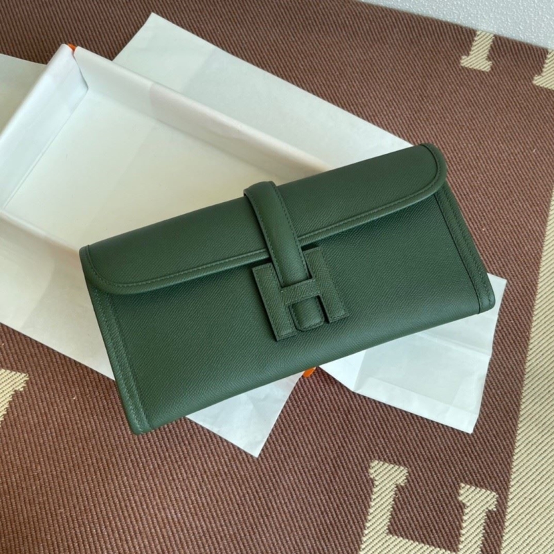 H**mes clutch bags
